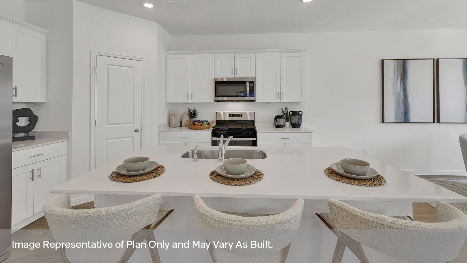 Kitchen with kitchen island and white cabinets.