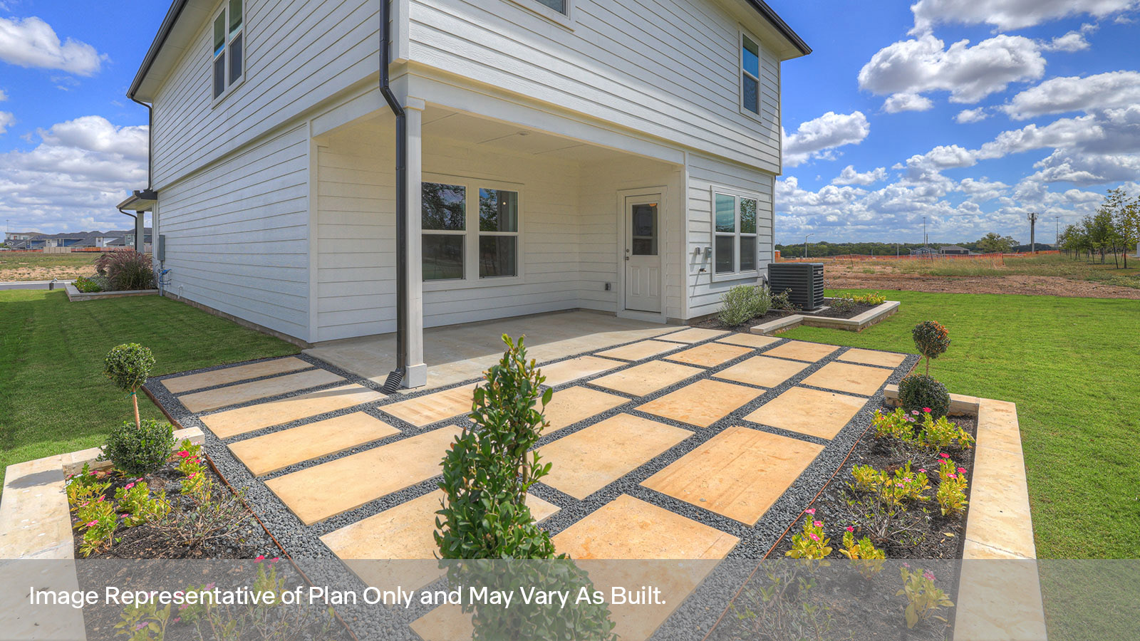 Covered patio and fully sodded backyard with privacy fence.