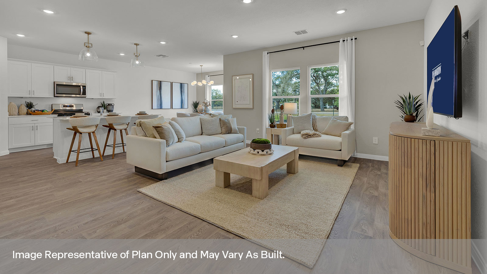 Living room with vinyl flooring and two windows opening to the kitchen.