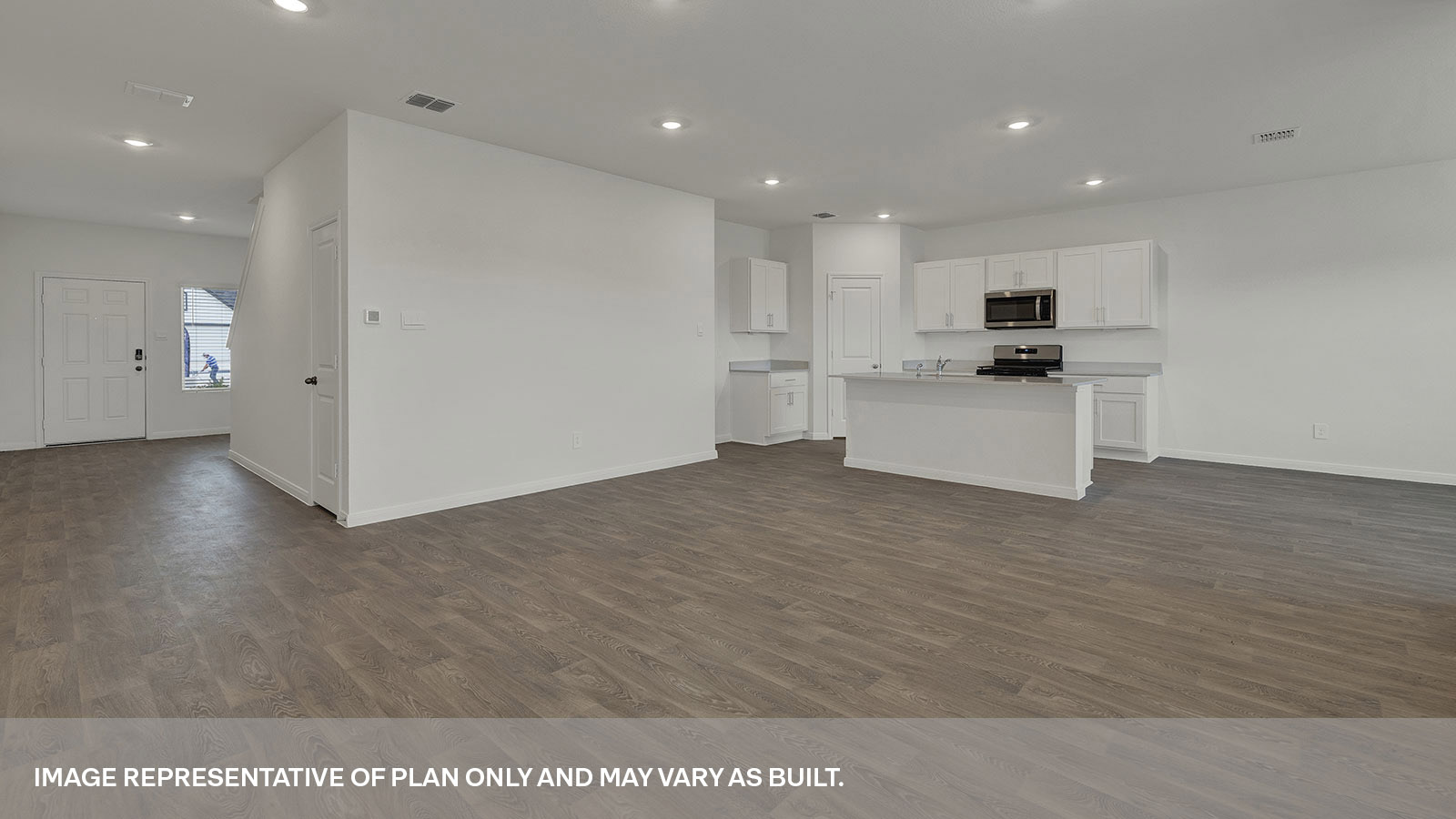 Living room with vinyl flooring and two windows opening to the kitchen.