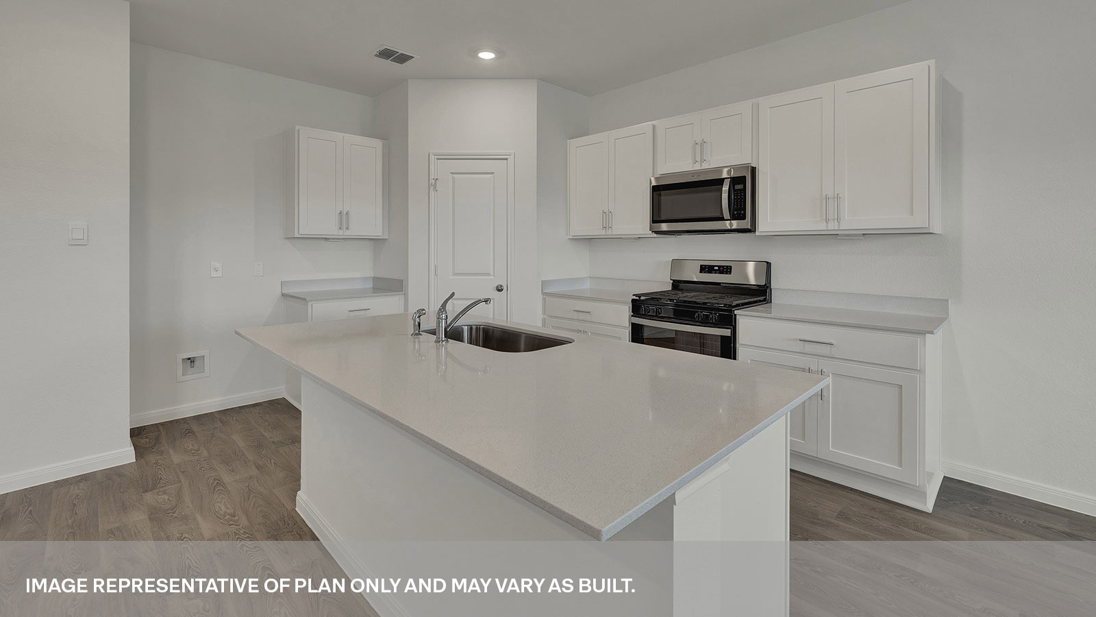 Kitchen with kitchen island and quartz countertops.