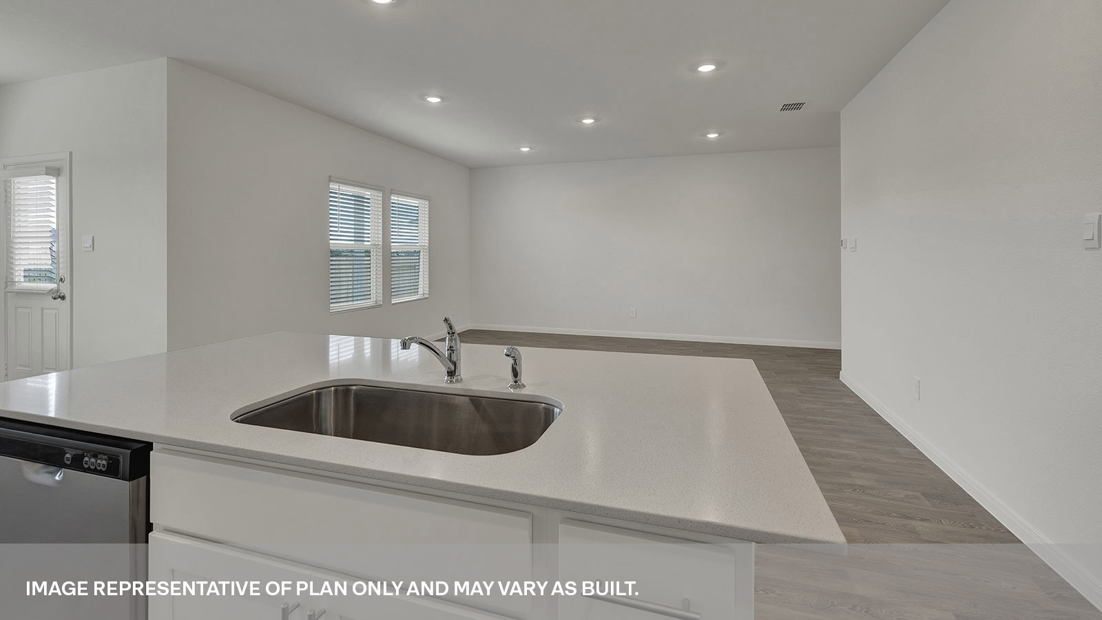 Kitchen island with sink overlooking the living room.