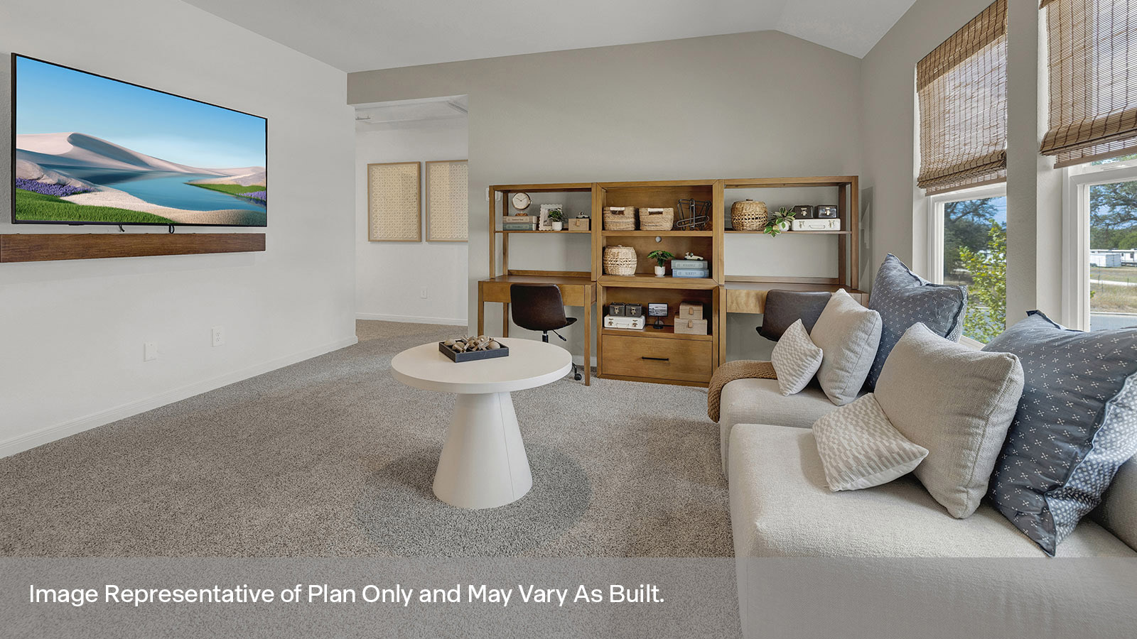Gameroom of off the staircase with carpeting and two windows.
