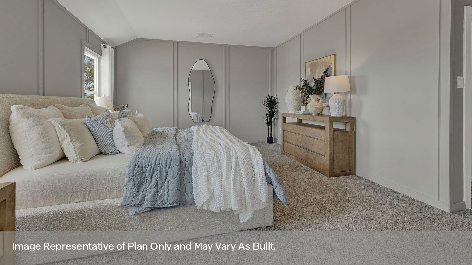 Main bedroom with carpeting and two windows.