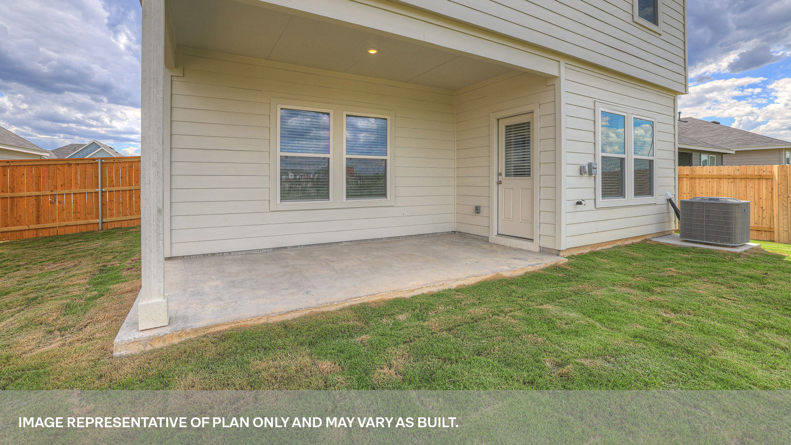 Covered patio with two windows and a half lite exterior door.