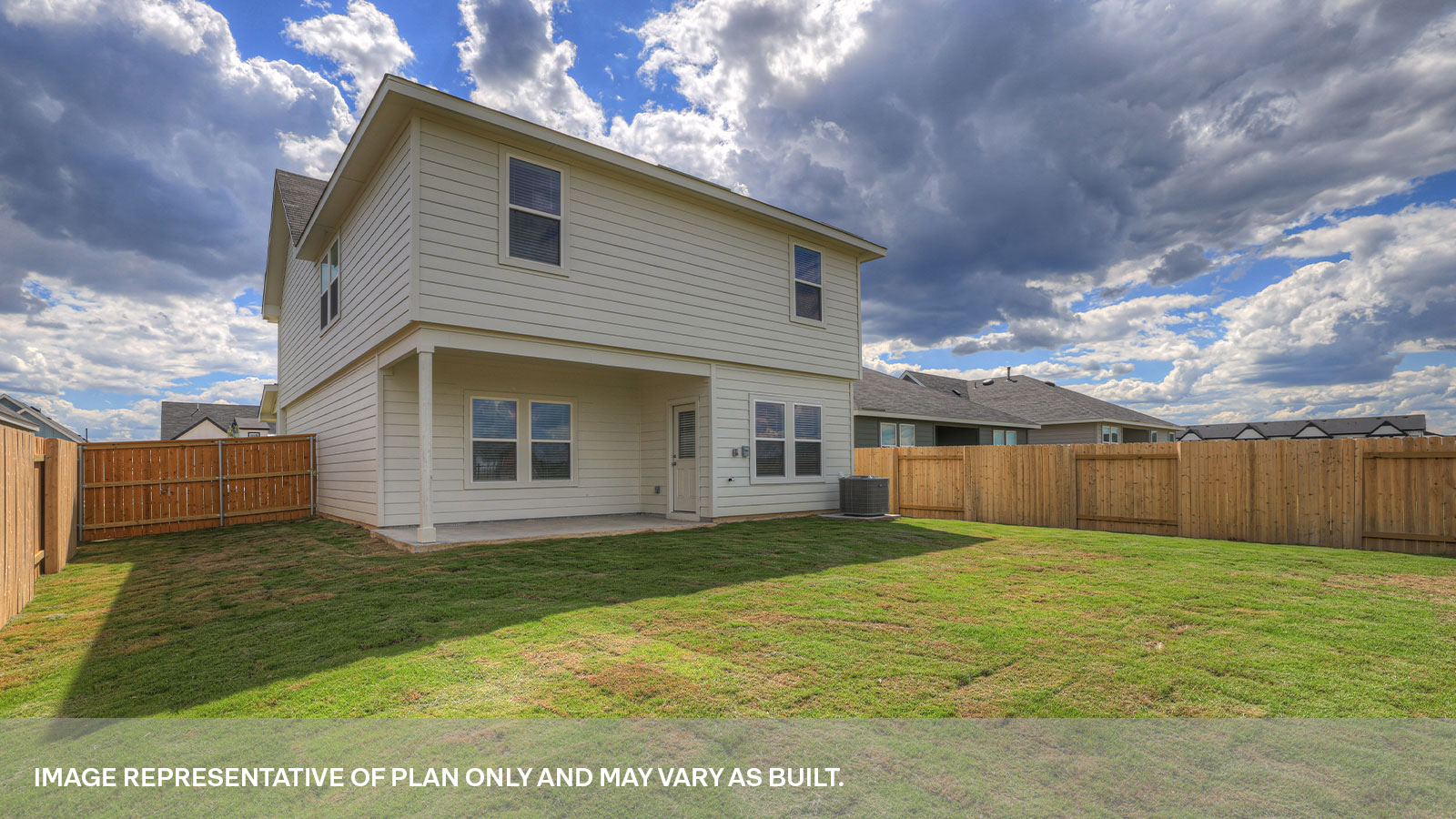 Covered patio and fully sodded backyard with privacy fence.