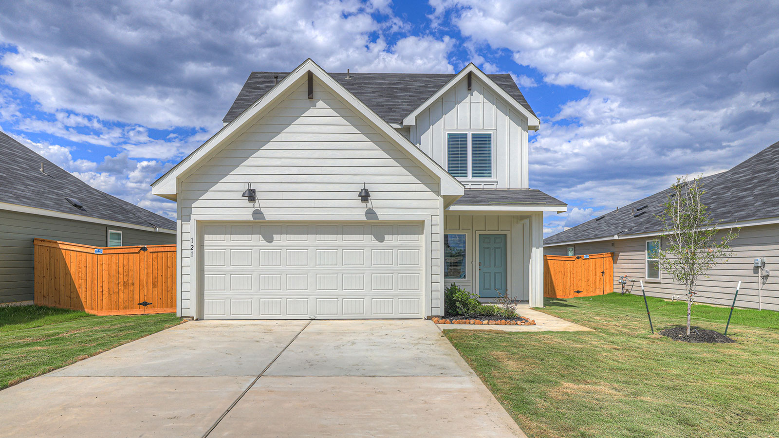 Nicole Floorplan with two windows and a two car garage.