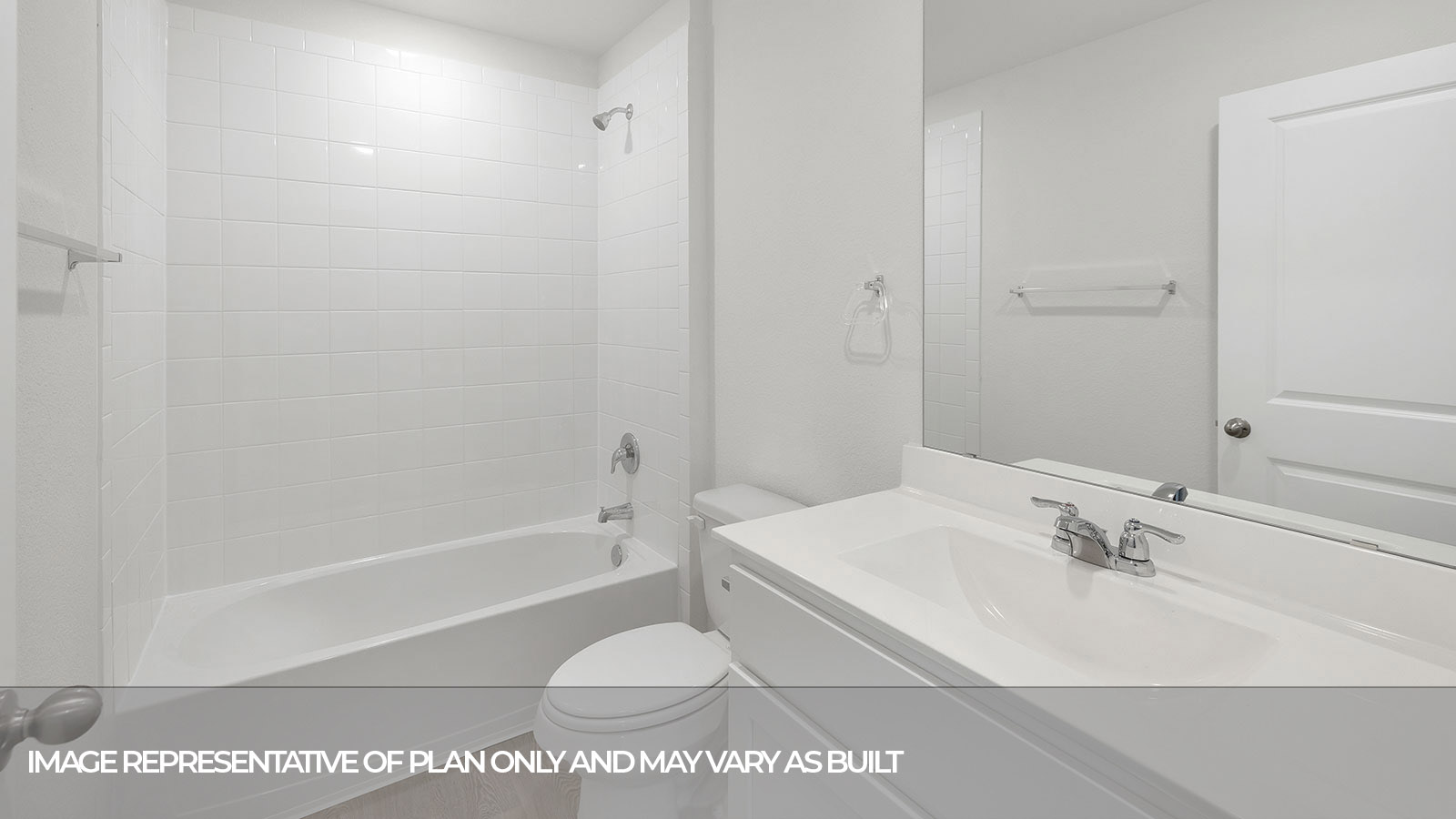 Single sink vanity with toilet and tub with tile surround.
