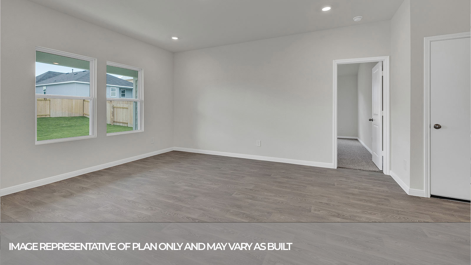 Living room opening to the kitchen and dining room.