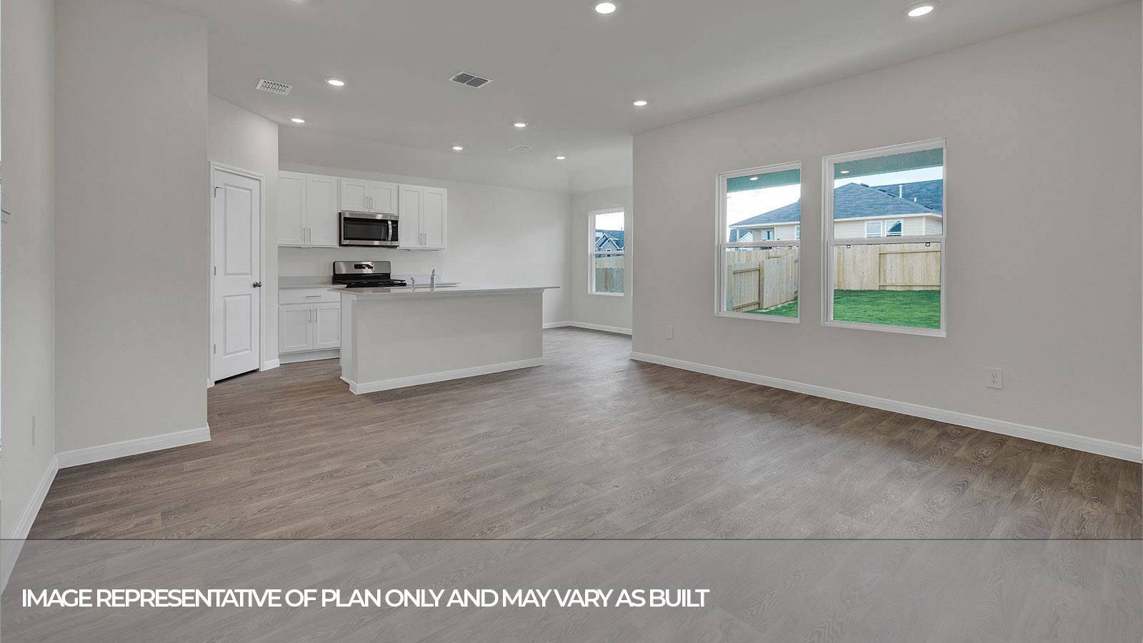 Living room and kitchen with vinyl flooring and two windows.