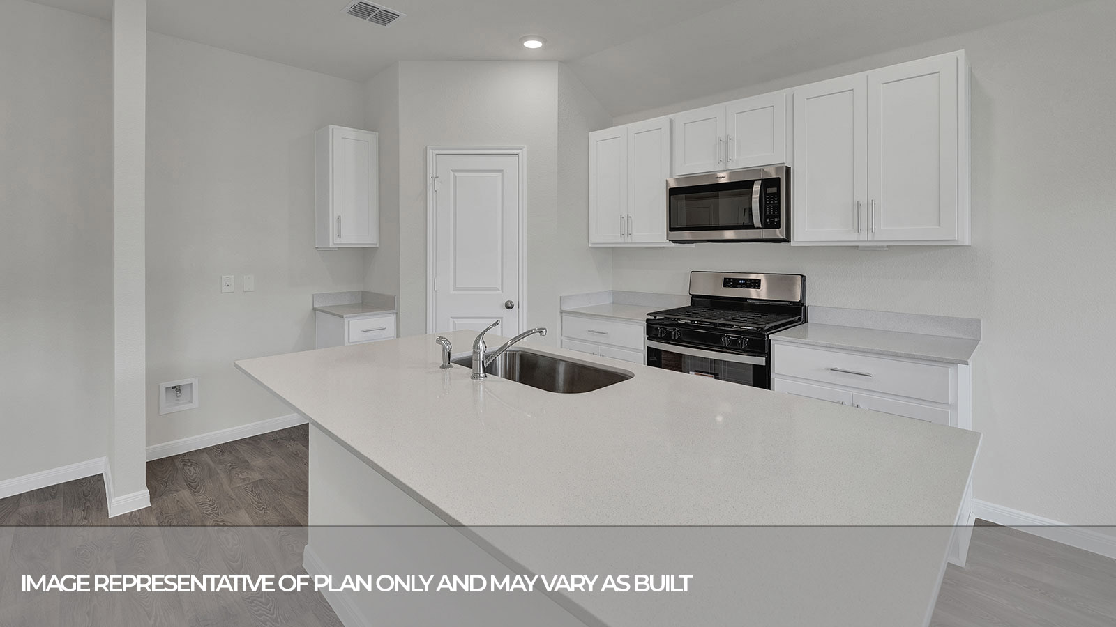 Kitchen island with granite countertops and kitchen sink.