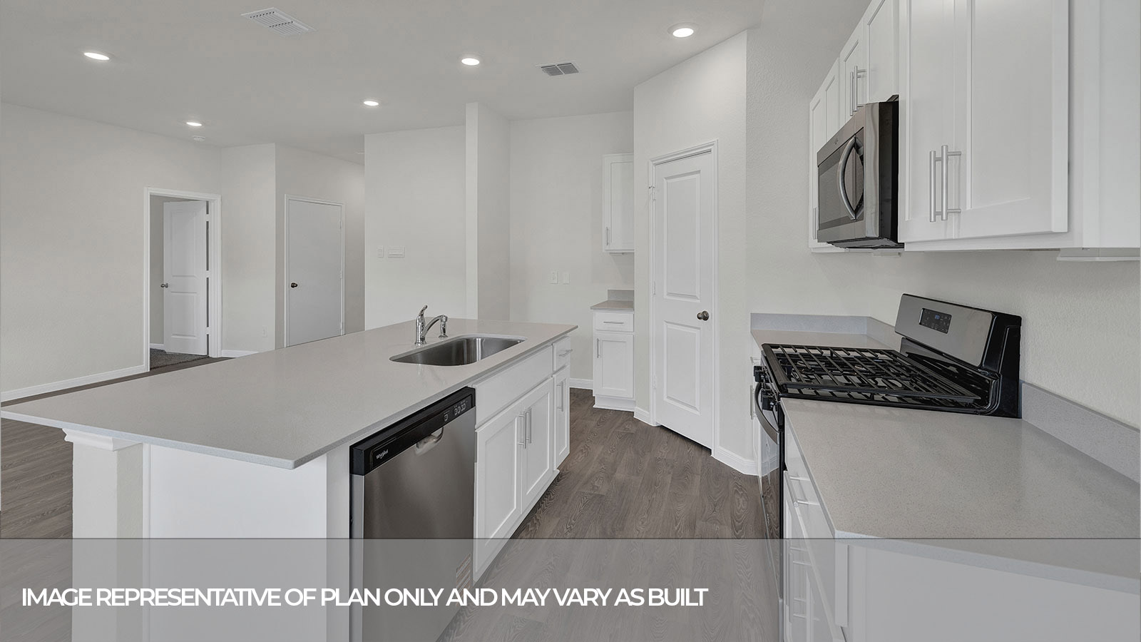Kitchen island with granite countertops and kitchen sink.