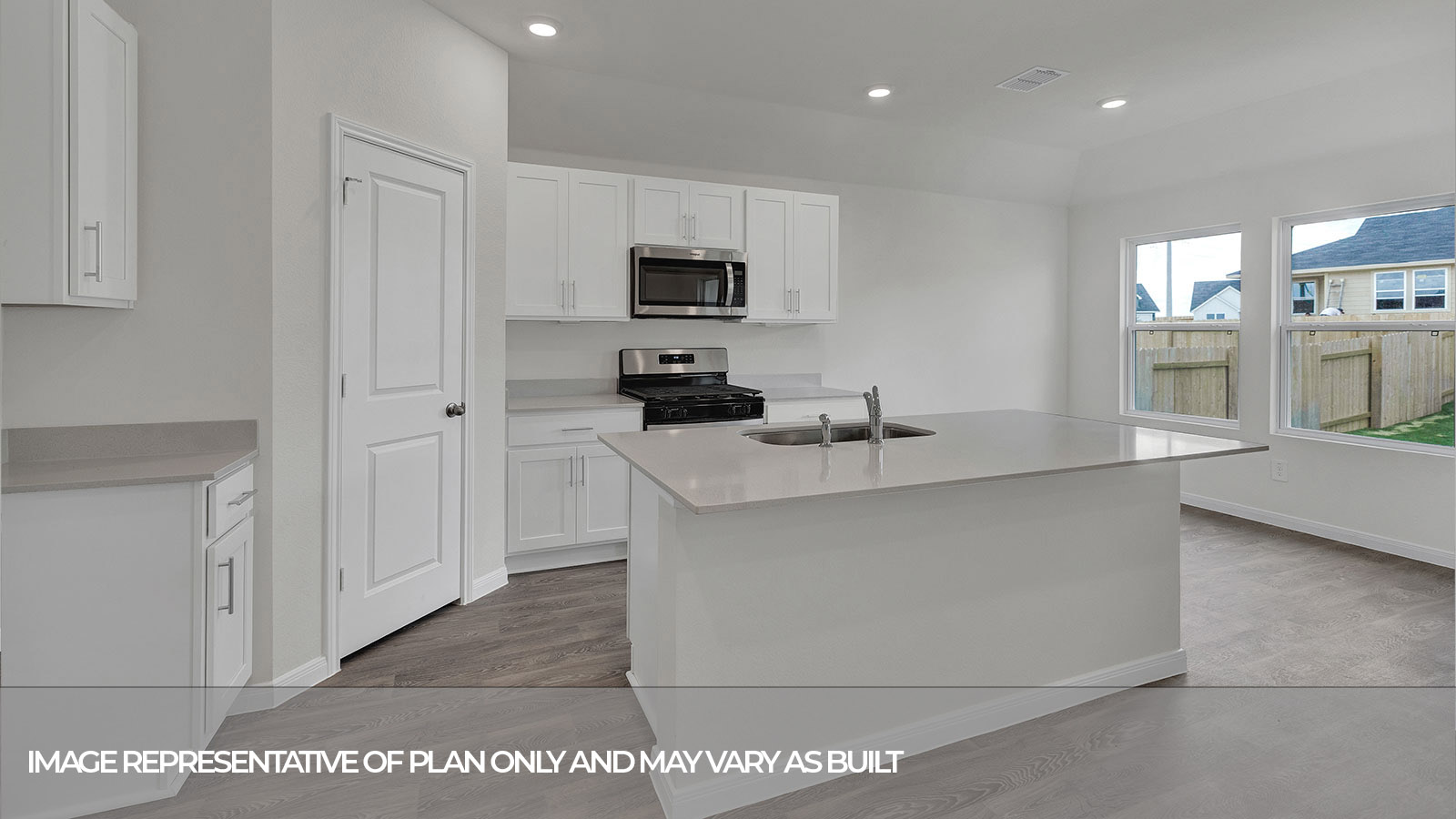 Kitchen island overlooking the living room and entry hallway.
