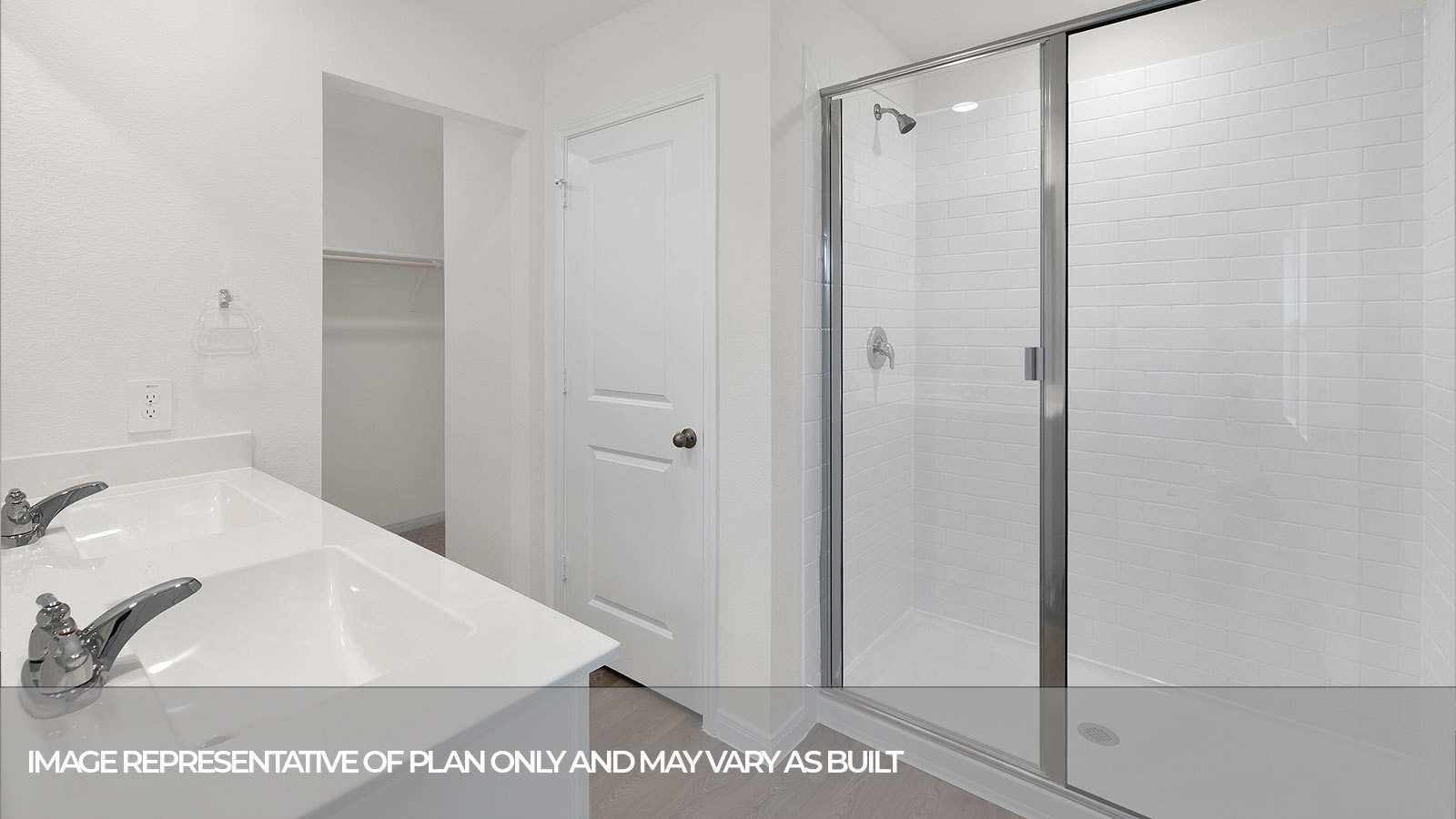 Main bathroom with large walk-in shower with glass door.