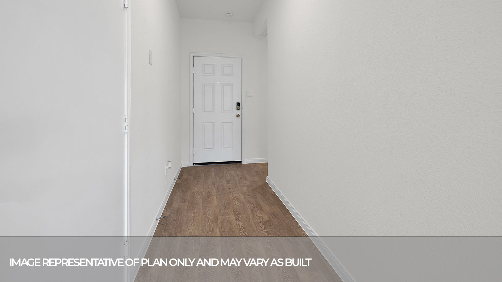 Entry hallway with vinyl flooring and front door.