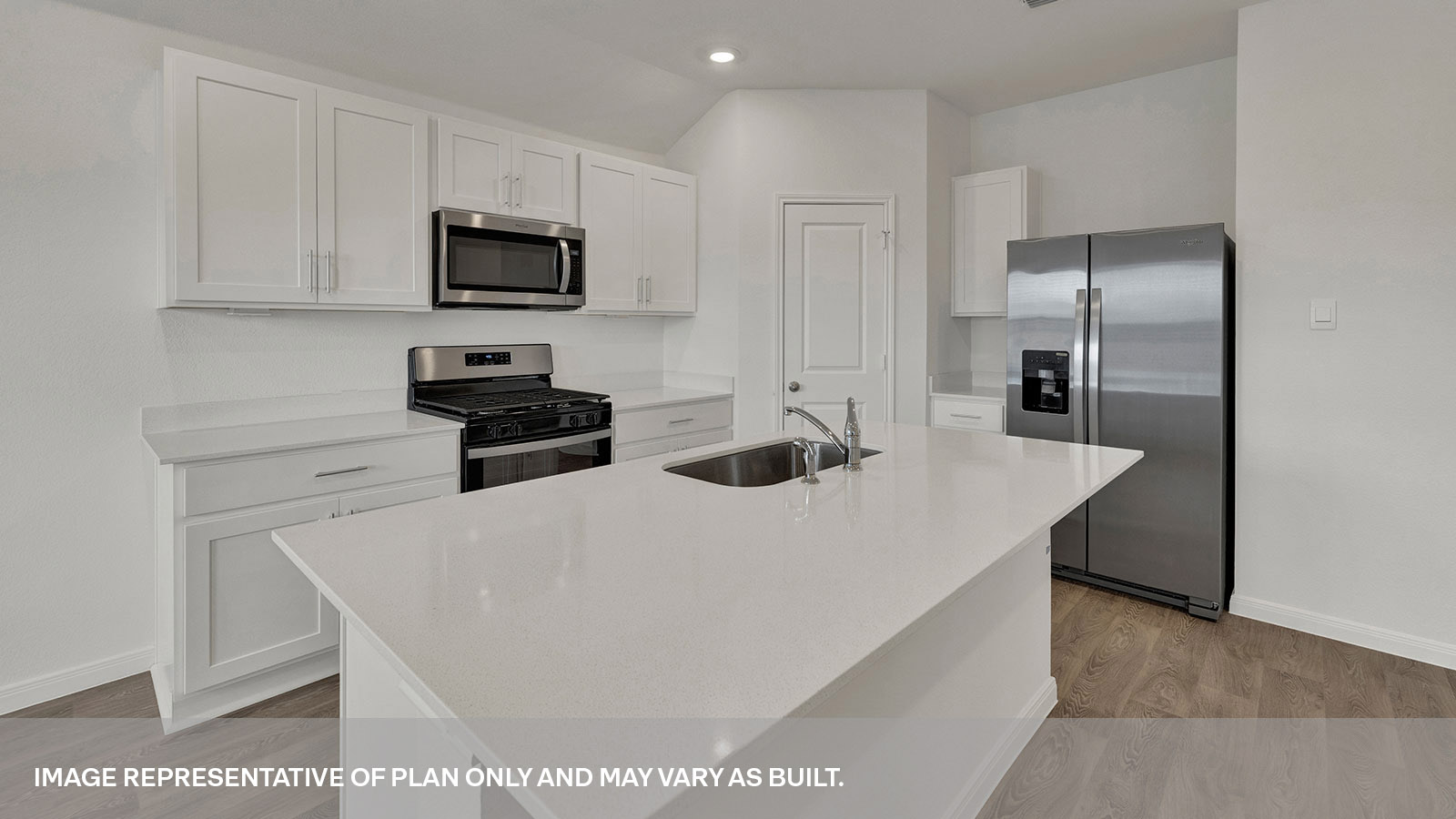 Kitchen with quartz countertops and kitchen sink.