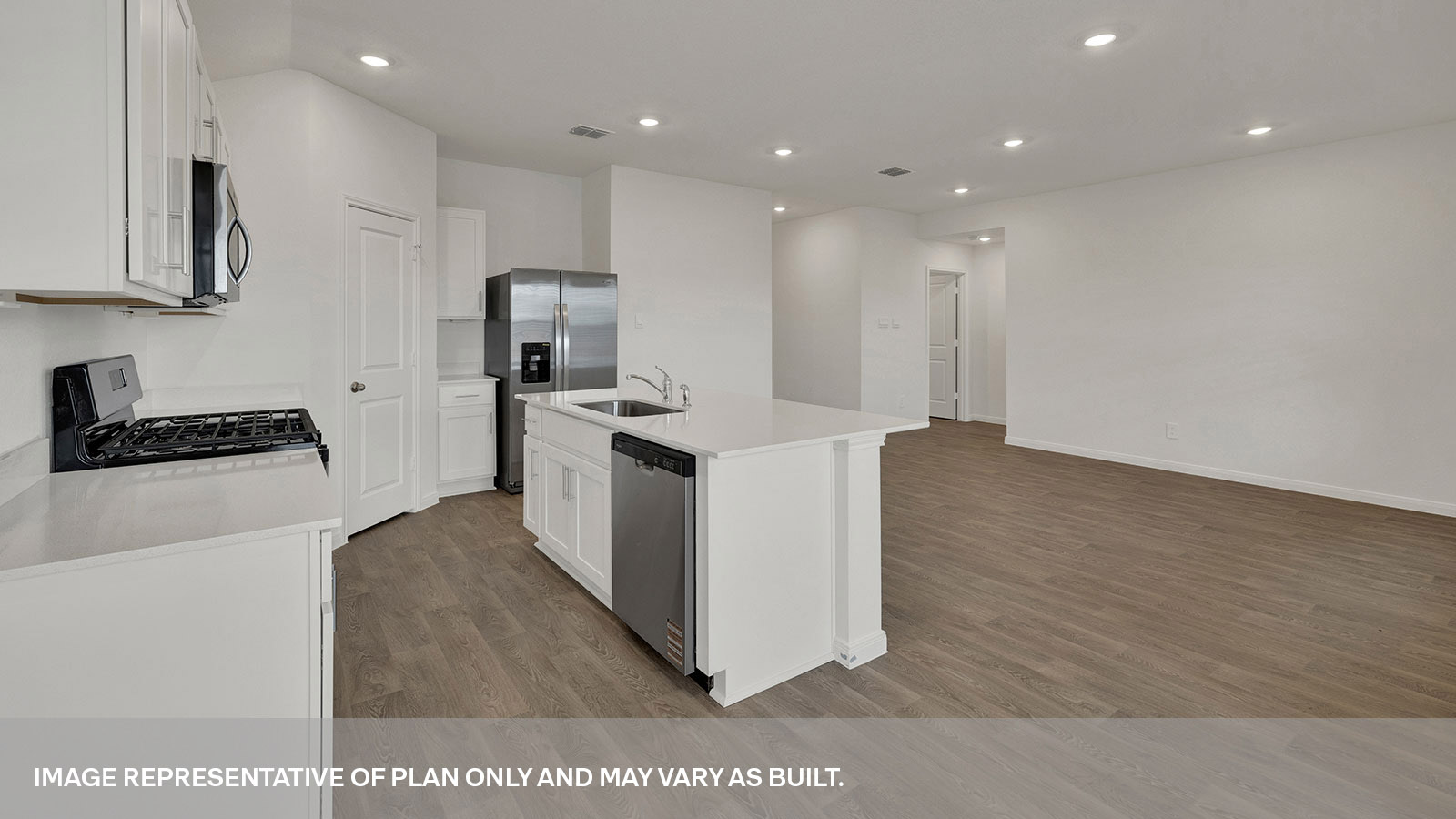 Kitchen with kitchen island overlooking the living room.