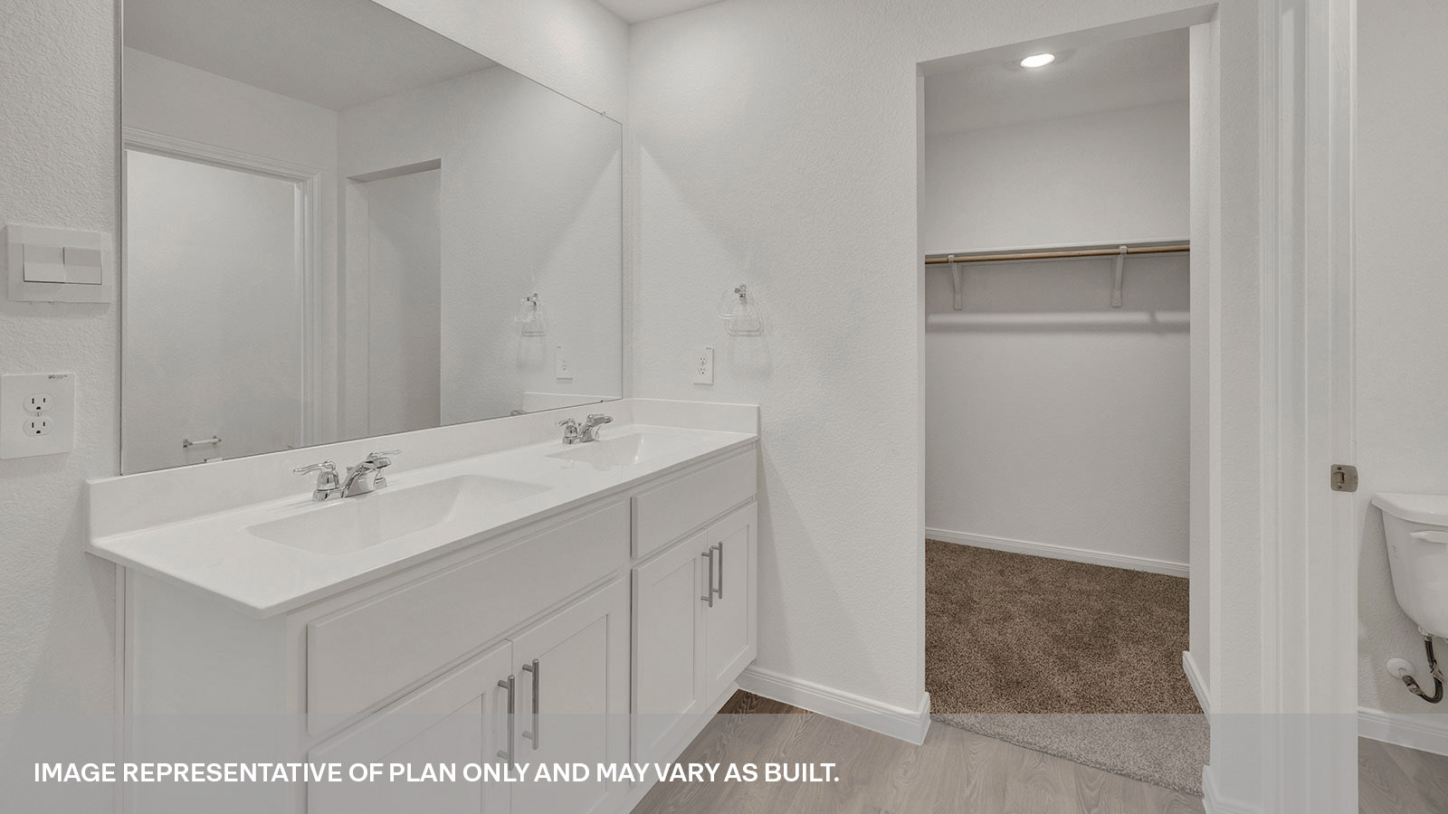 Main bathroom double sink vanity and closet.