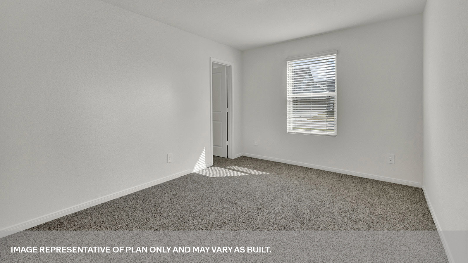 Front bedroom with carpeting and one window.
