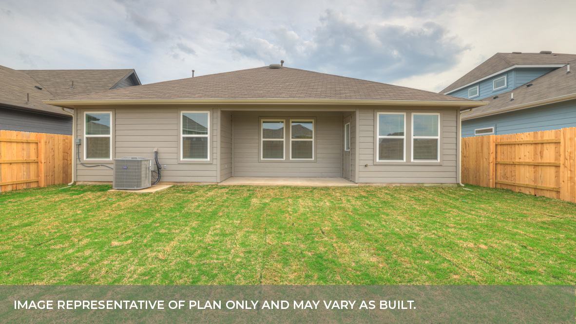 Covered patio with fully sodded backyard and privacy fence.