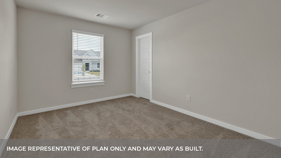 Front bedroom with carpeting and one window.