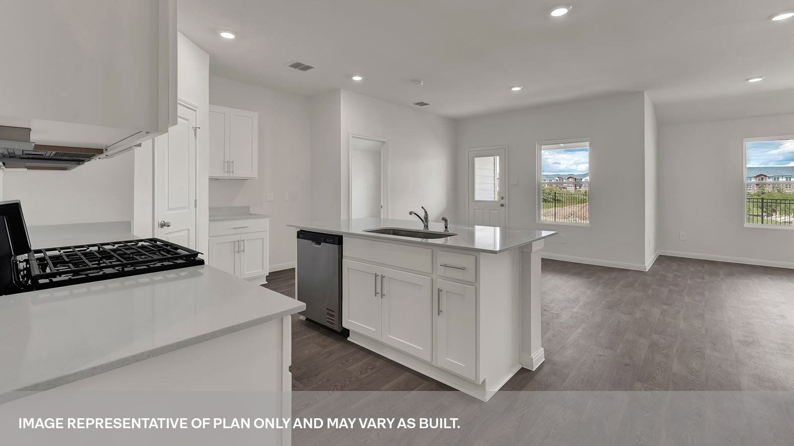 Kitchen island with large kitchen sink looking over the living room.