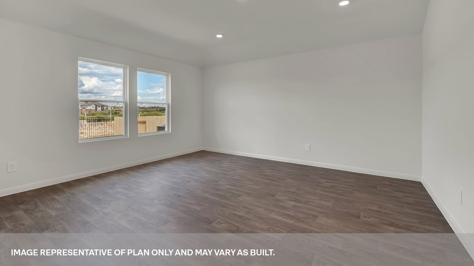 Living room with vinyl flooring and two windows.