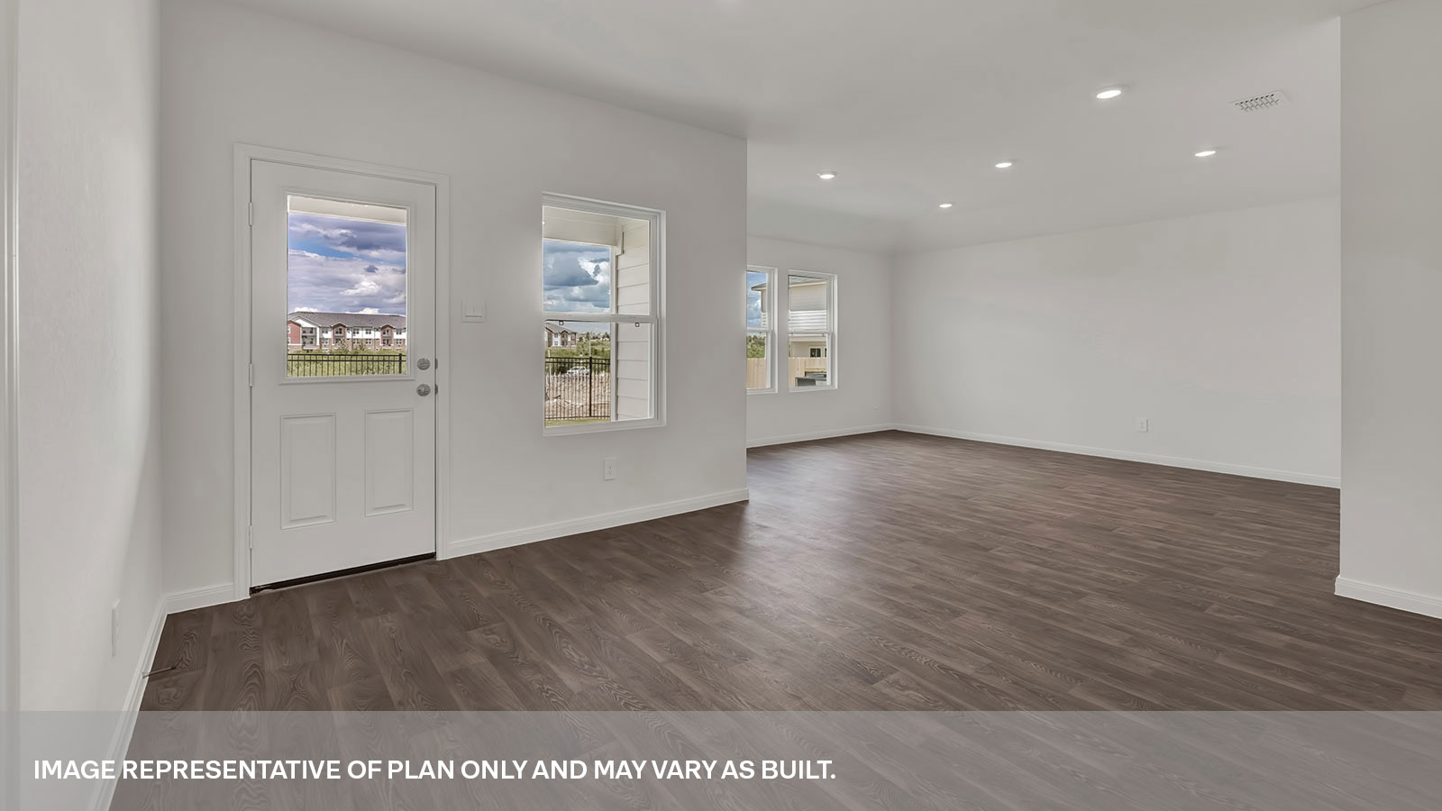 Dining room with vinyl flooring,one window, and a half lite exterior door.