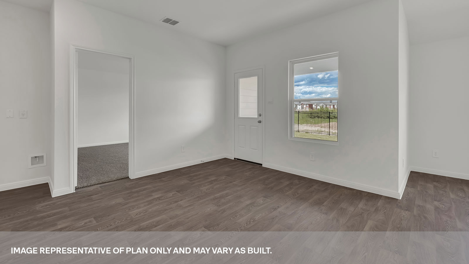 Dining room with vinyl flooring,one window, and a half lite exterior door.