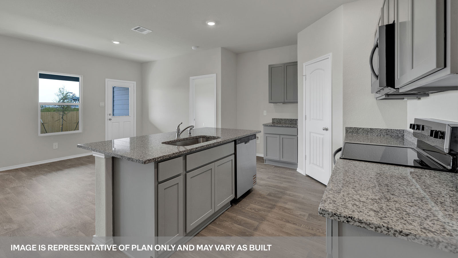 Kitchen with granite countertops and white cabinets.