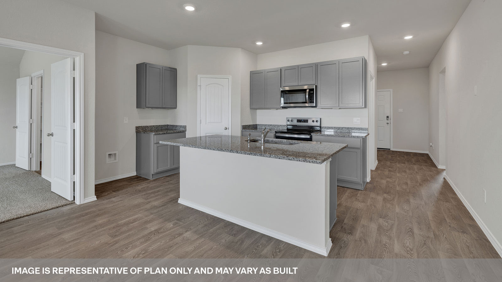 Kitchen with granite countertops and white cabinets.