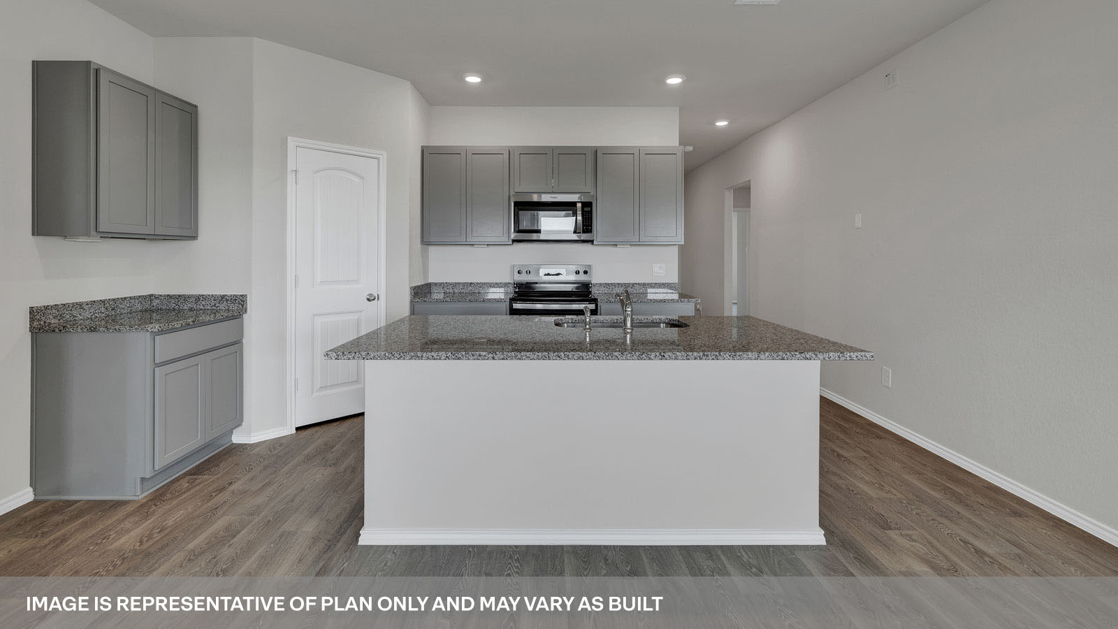Kitchen with granite countertops and white cabinets.