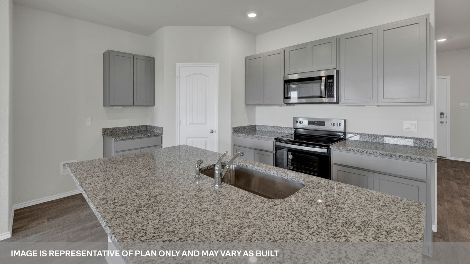 Kitchen with granite countertops and white cabinets.