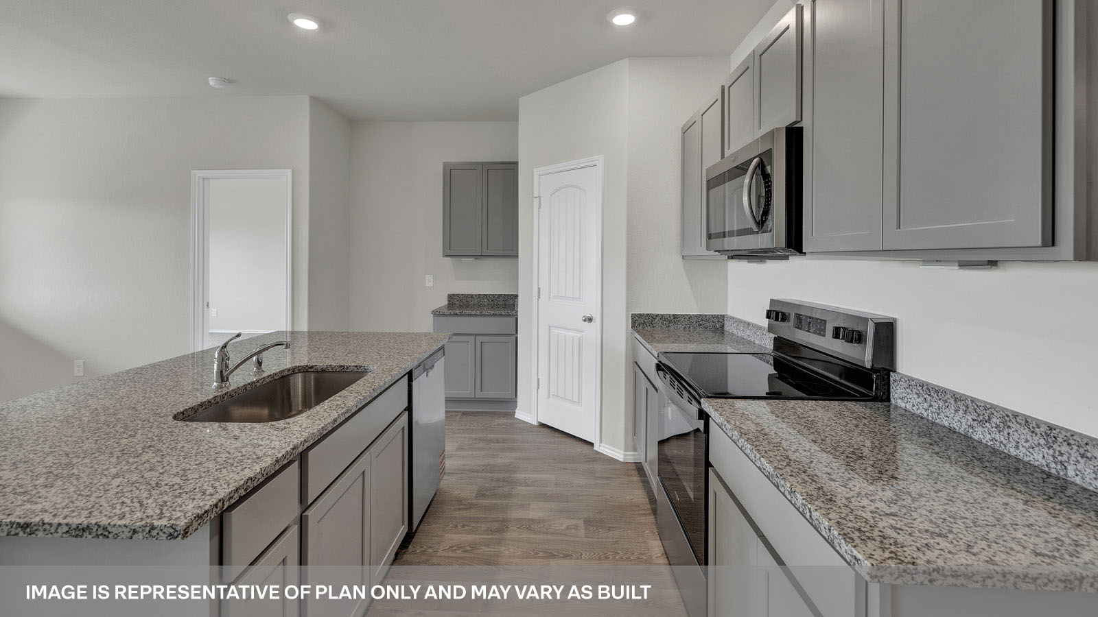 Kitchen with granite countertops and white cabinets.