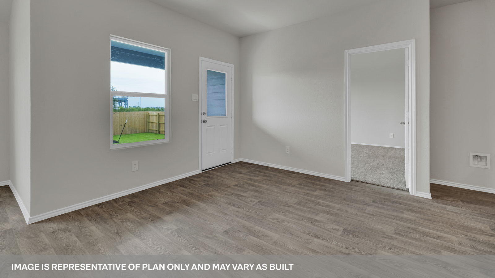 Dining room with vinyl flooring and two windows.