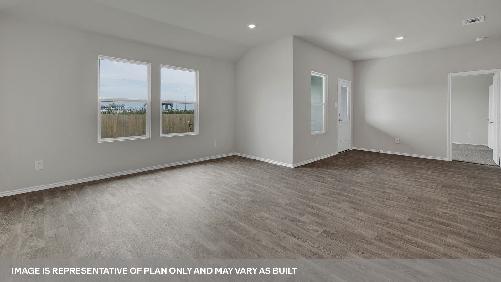 Living room and dining room with vinyl flooring 3 windows