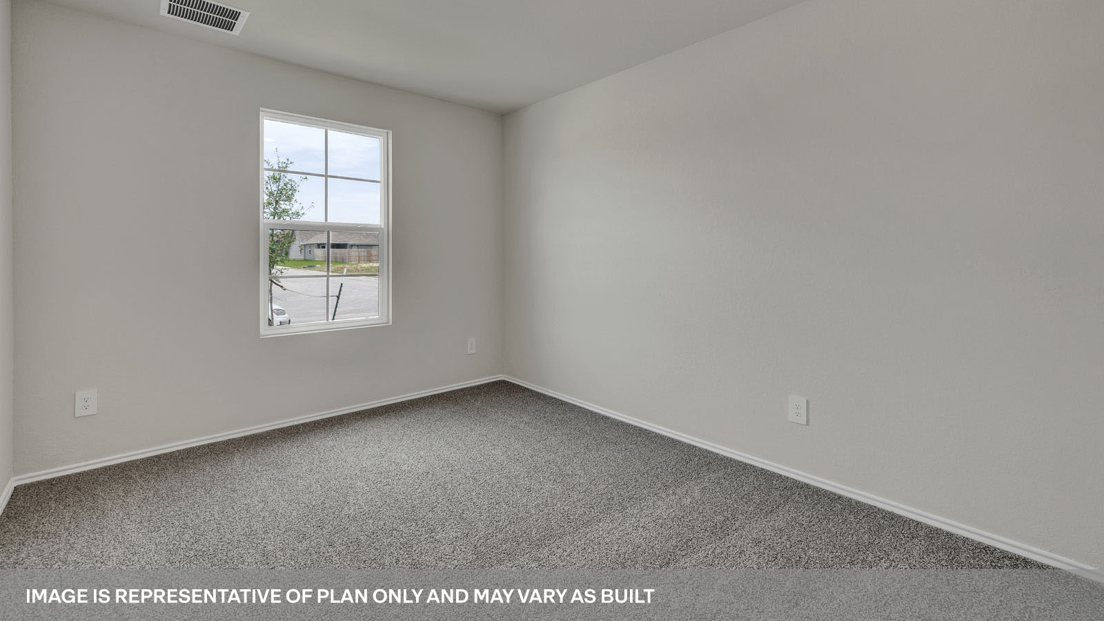 Front bedroom with carpeting and one window.