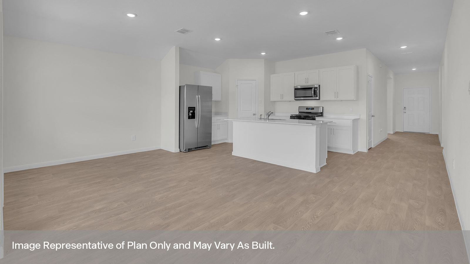 Kitchen with kitchen island and entry hallway.
