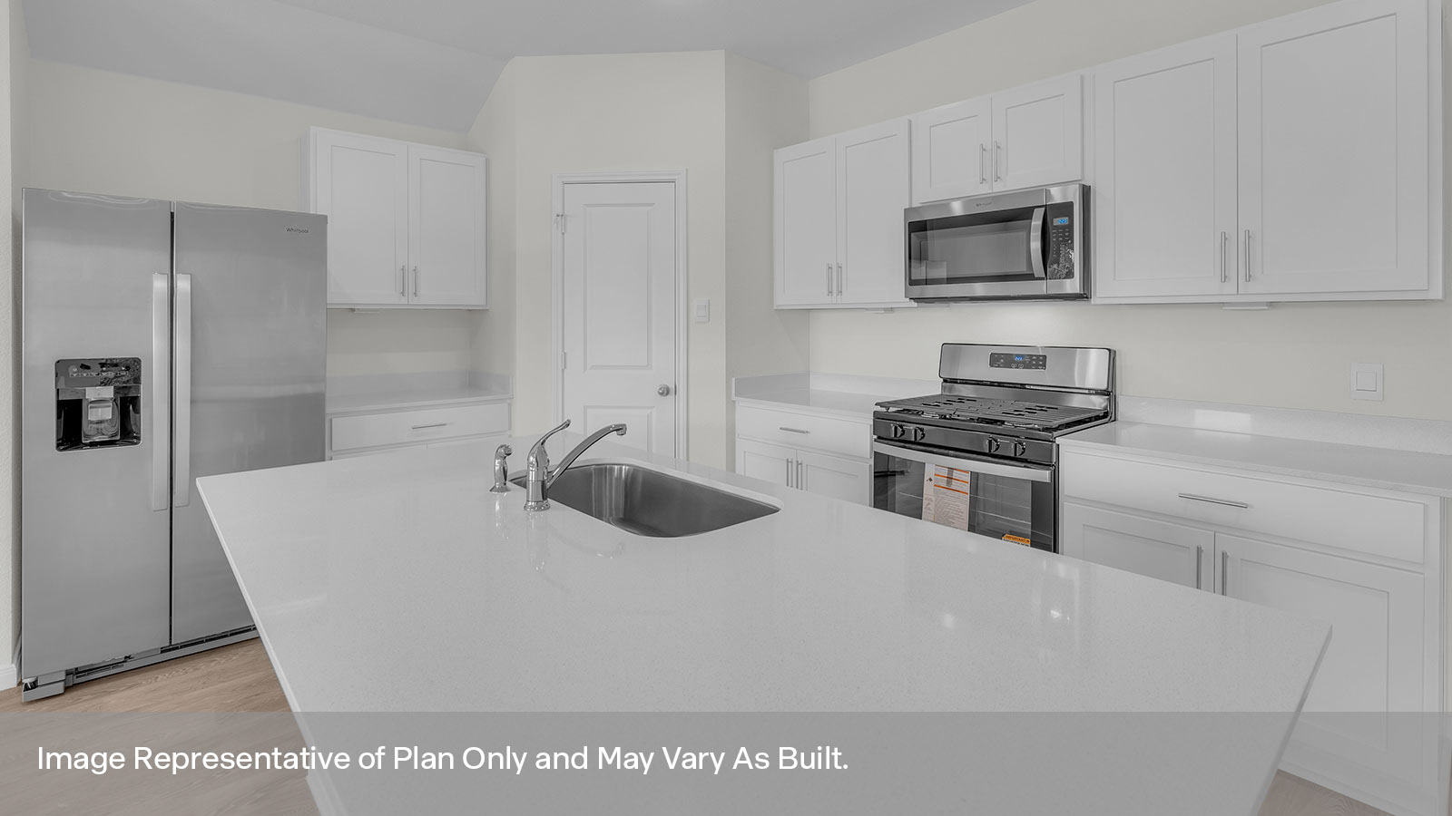 Kitchen with kitchen island and quartz countertops.