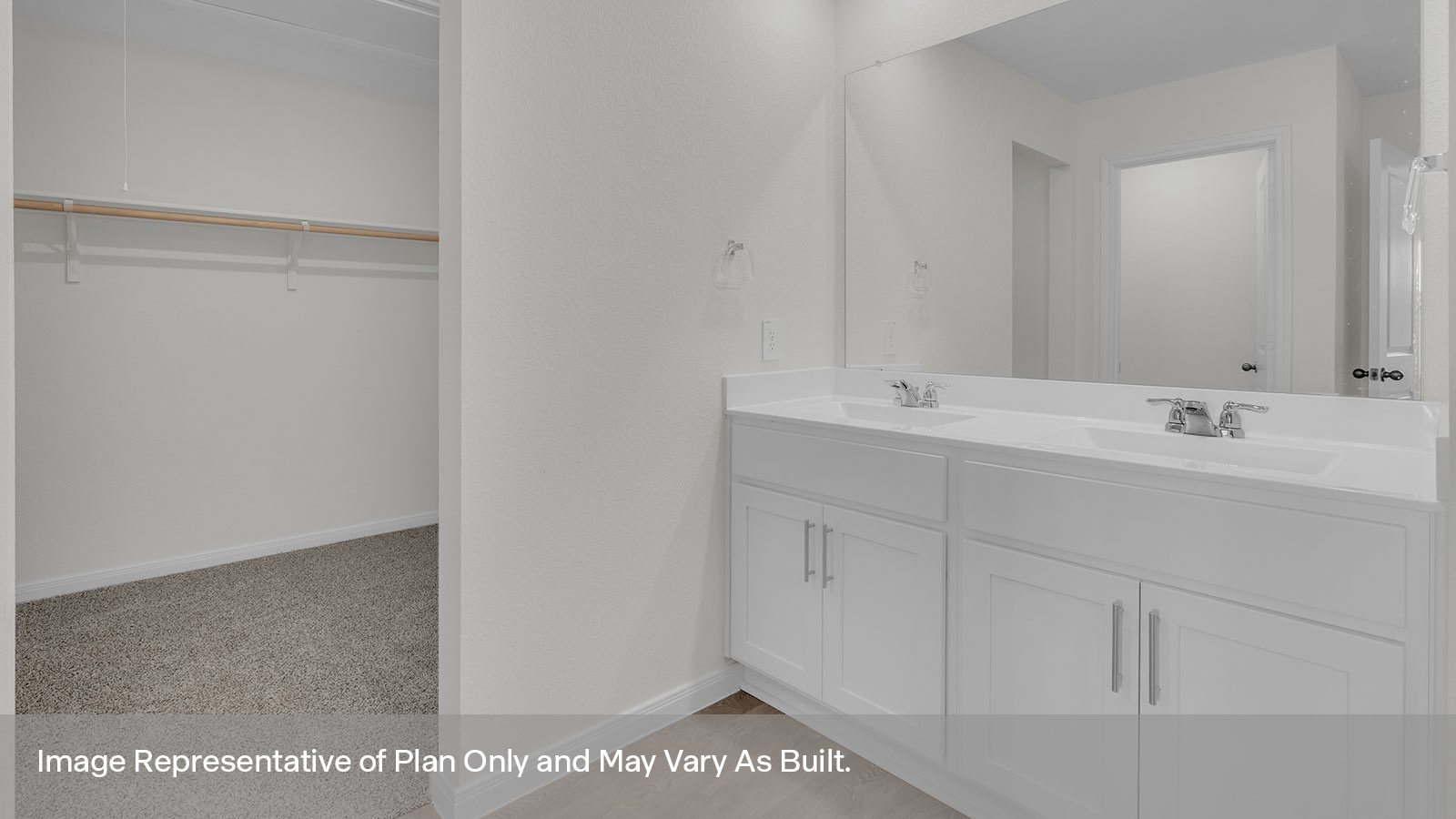Main bathroom with wooden shelving, closet, and vanity.