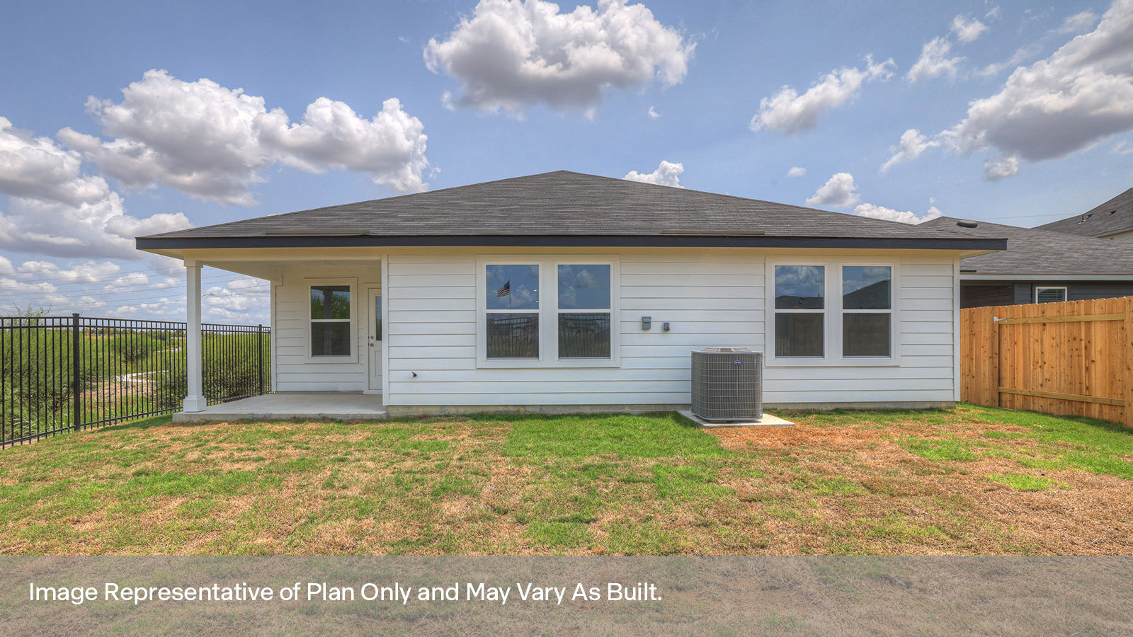 Covered patio with fully sodded backyard and privacy fence.