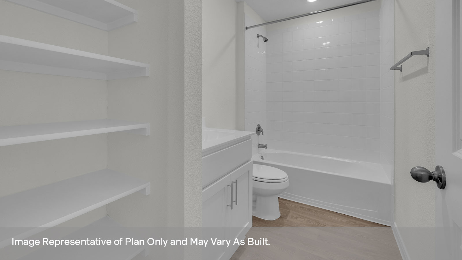 Hall bathroom with wooden shelving, toilet, and tub.
