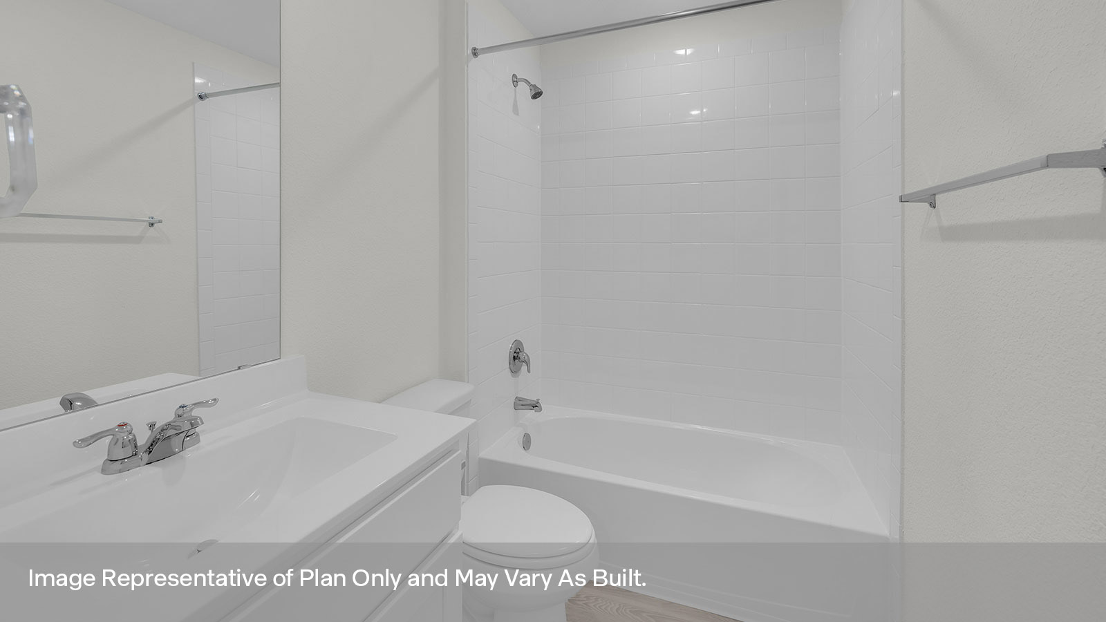 Bathroom with single sink vanity, toilet, and tile surround with tub/shower combo.