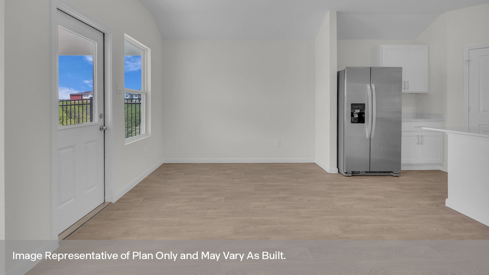 Dining room with vinyl flooring, one window, and a half lite exterior door.