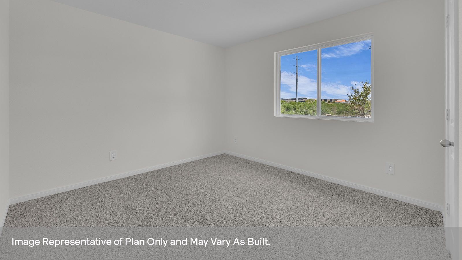 Front bedroom with carpeting and two windows.