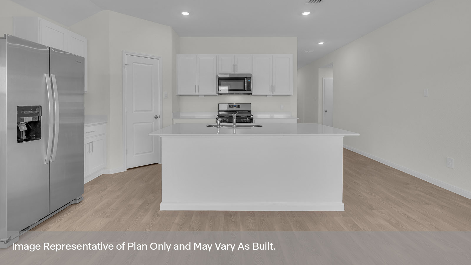 Kitchen with kitchen island and white cabinets.