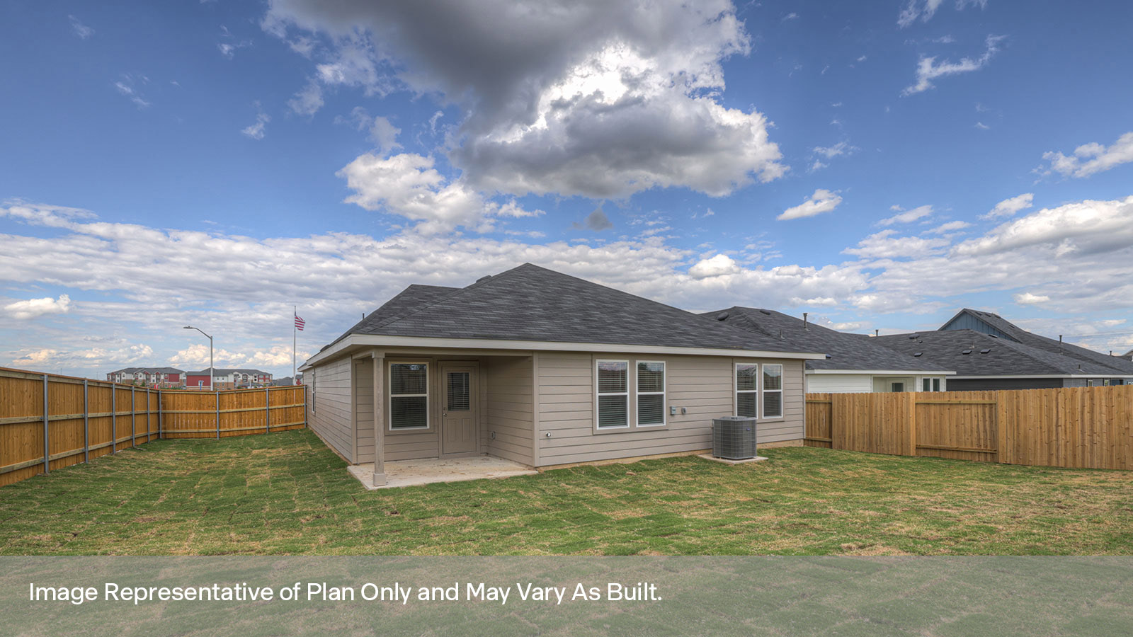Covered patio with fully sodded backyard and privacy fence.