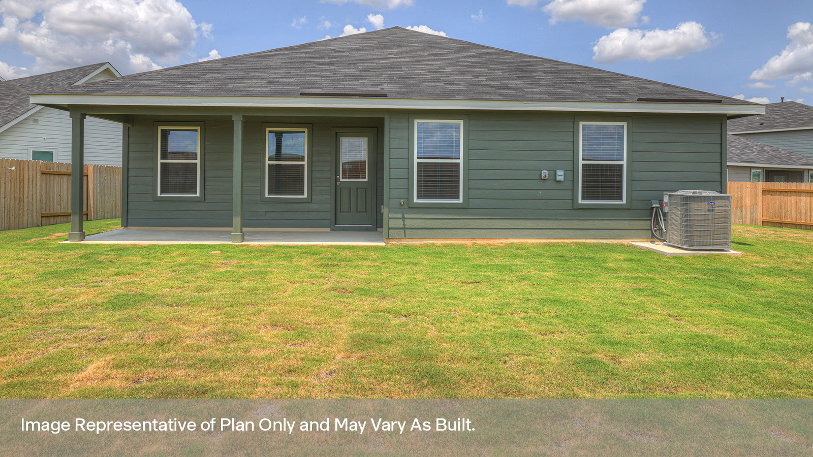 Covered patio with 2 windows and a fully sodded backyard.