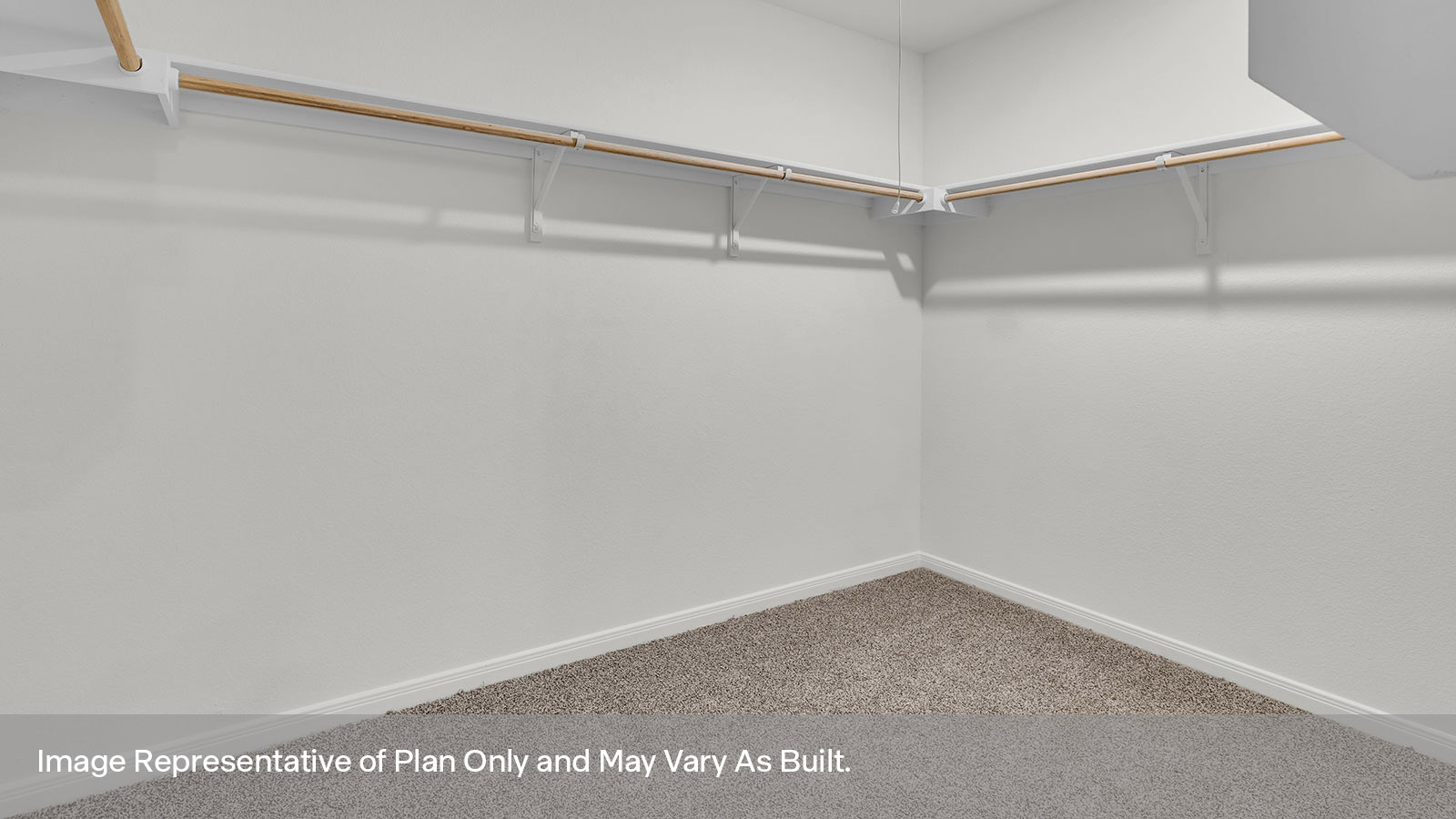 Large walk-in closet with wooden shelving.