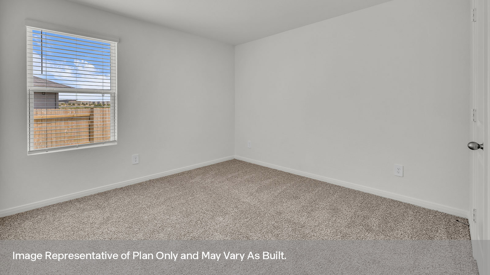 Bedroom with carpeting and one window.